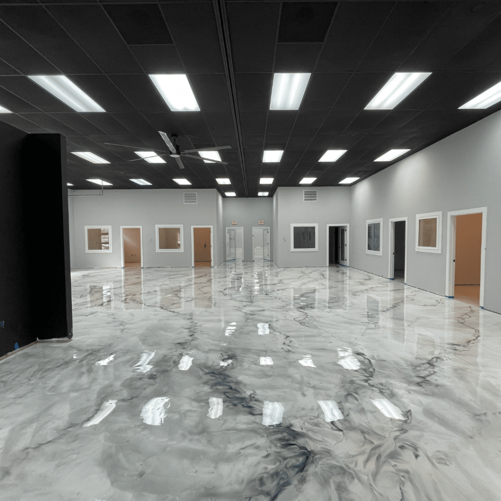 Our Work - Photo of an indoor metallic marble epoxy floor, featuring a high-gloss finish and a unique metallic marble pattern that provides a durable, low-maintenance, and aesthetically pleasing option for homeowners or businesses.