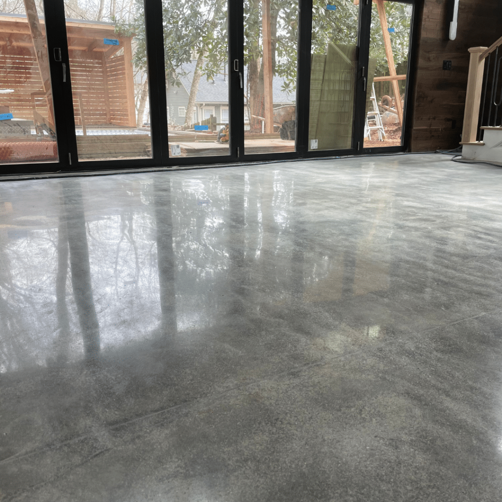 Our Work - Photo of a polished concrete residential floor featuring a smooth and glossy surface that provides a durable and aesthetically pleasing flooring option for homeowners.