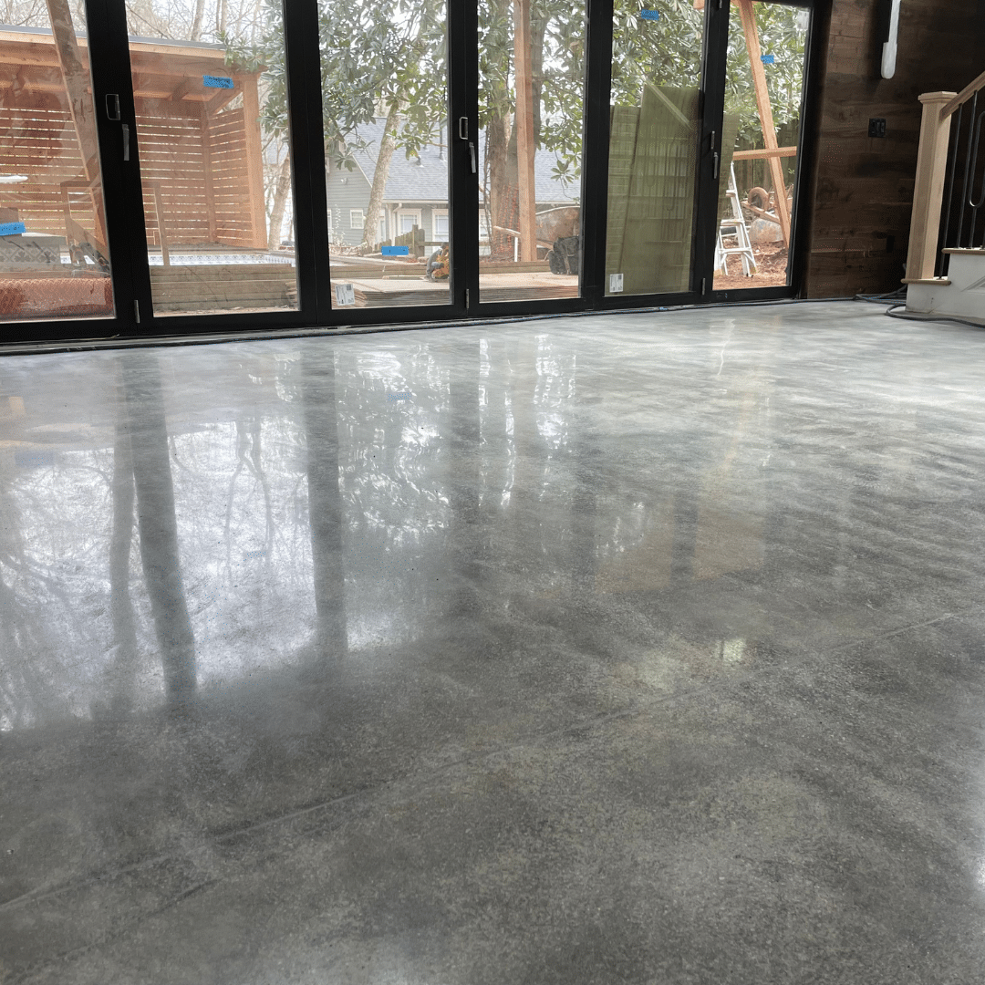 Photo of a polished concrete residential floor featuring a smooth and glossy surface that provides a durable and aesthetically pleasing flooring option for homeowners.